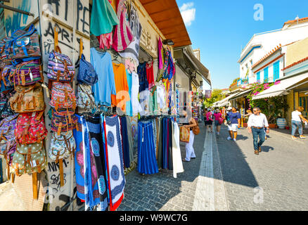 Tourists shop the colorful markets and stores in the Monastiraki district of Athens, Greece. Stock Photo