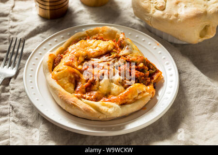 Homemade Chicago Pizza Pot Pie with Cheese and Sausage Stock Photo