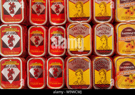 Stacks of tins of various types of sardines on display in Conserverie la belle-iloise in Dieppe, France. Stock Photo