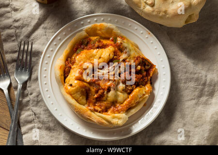 Homemade Chicago Pizza Pot Pie with Cheese and Sausage Stock Photo