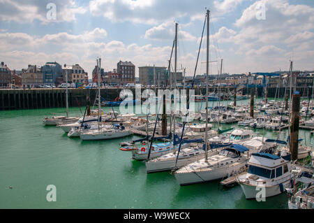 Various sailboats, yachts and leisure boats moored along the Henry IV quay in the Dieppe marina, Normandy France. Stock Photo