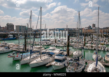 Various sailboats, yachts and leisure boats moored along the Henry IV quay in the Dieppe marina, Normandy France. Stock Photo