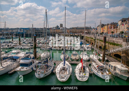 Various sailboats, yachts and leisure boats moored along the Henry IV quay in the Dieppe marina, Normandy France. Stock Photo