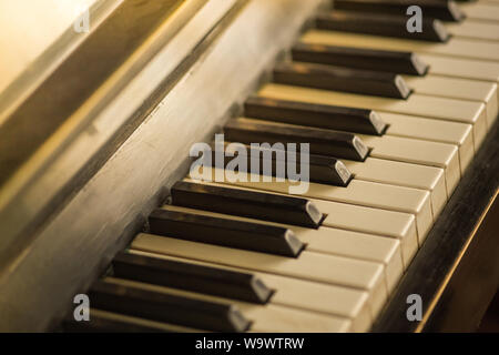 Piano keyboard background with selective focus, warm colors Stock Photo