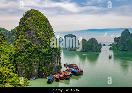 Aerial view of the majestic landscape with geologic karst rock formations in Halong Bay with cruise ships, North Vietnam, Asia. Stock Photo