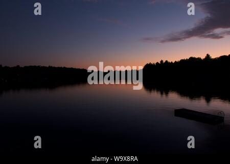 Sunset over the lake in McKellar, Ontario. Beautiful red sky Stock Photo