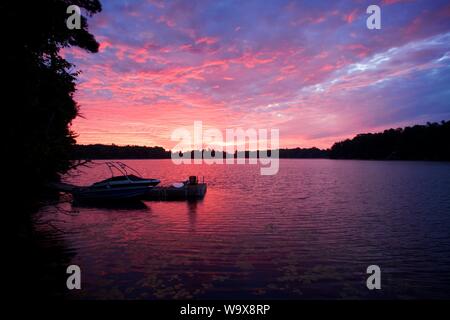 Sunset over the lake in McKellar, Ontario. Beautiful red sky Stock Photo