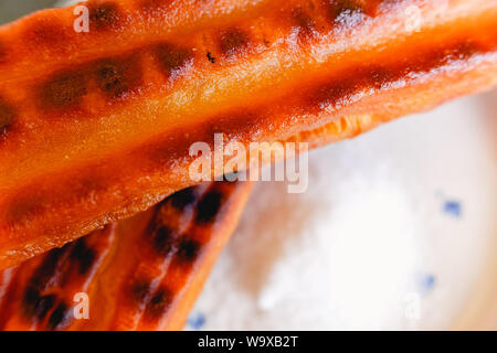 Traditional churro fried in oil for breakfast, made with wheat flour dough. Stock Photo