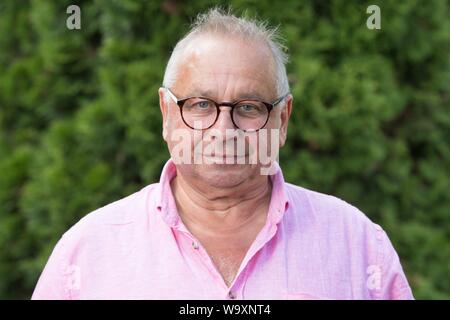 Freital, Germany. 14th Aug, 2019. The German actor Hilmar Eichhorn stands in his garden. Eichhorn celebrates his 65th birthday on 18 August. Credit: Sebastian Kahnert/dpa-Zentralbild/dpa/Alamy Live News Stock Photo