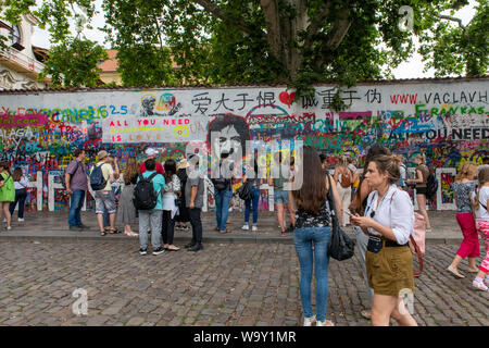 Crowds gather at the John Lennon Wall in Prague, Czech Republic Stock Photo