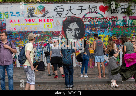 Crowds gather at the John Lennon Wall in Prague, Czech Republic Stock Photo