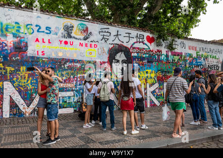 Crowds gather at the John Lennon Wall in Prague, Czech Republic Stock Photo