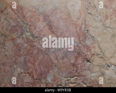Pink and yellow weathered marble texture. Stone background seamless pattern. Stock Photo