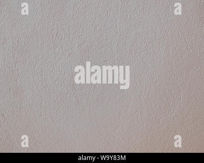 Textured grinded plaster in light beige. Background or texture seamless pattern. Stock Photo