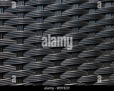 Knitted plastic furniture texture. Background seamless pattern. Stock Photo