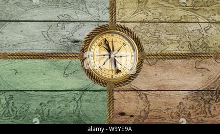 Compass anchor wheel from old ropes on wood Stock Photo