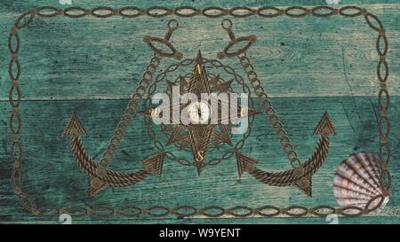 Compass anchor wheel from old ropes on wood Stock Photo