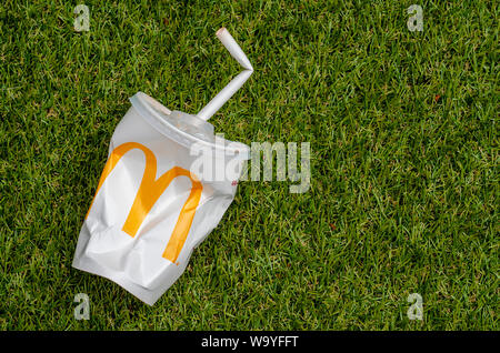 McDonald's Empty Cola Cup with Paper Straw, McDonald's is the world's largest chain of hamburger fast food restaurants. Stock Photo