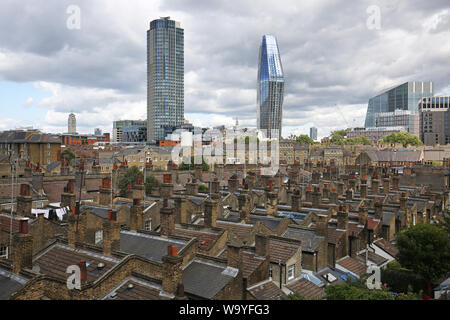 The Victorian roof tops of the Roupell Street conservation area near Waterloo Station, London, UK. No 1 Blackfiars and Southbank Tower in background. Stock Photo