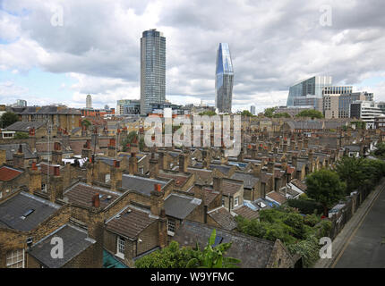 The Victorian roof tops of the Roupell Street conservation area near Waterloo Station, London, UK. No 1 Blackfiars and Southbank Tower in background. Stock Photo
