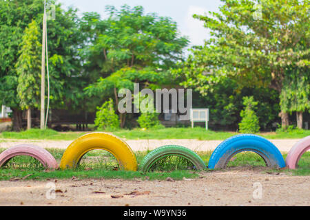 Colour of the car wheels on a lawn with sunlight. Stock Photo