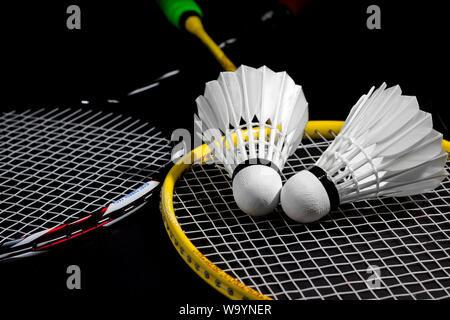 Racket and Shuttlecock with use sport or exercise on a black background. Stock Photo