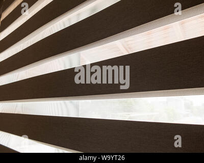 Horizontal striped curtains made from natural material. Stock Photo