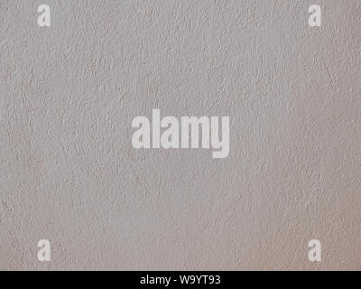 Textured grinded plaster in light beige. Background or texture seamless pattern. Stock Photo
