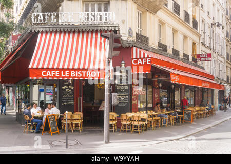 Paris street scene on Boulevard Magenta, in front of the cafe Le Bistrot, in the 10th arrondissement. France, Europe. Stock Photo