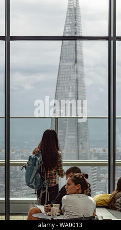 Admiring the view of The Shard from Sky Garden, London Stock Photo