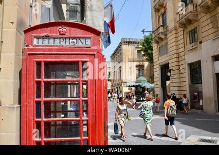 british red telephone box kiosk on republic street valletta malta Stock Photo