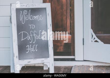 Closeup shot of a welcome text written on a small chalkboard