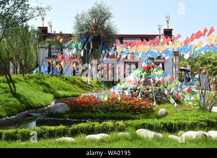 (190816) -- BEIJING, Aug. 16, 2019 (Xinhua) -- Tourists visit the Tibet Garden at the Beijing International Horticultural Exhibition in Beijing, capital of China, Aug. 15, 2019. Tibet has seen significant progress in restoring biodiversity, with a forest coverage rate of 12.14 percent, said a white paper released in March this year by China's State Council Information Office.    The population of Tibetan antelopes has grown from 60,000 in the 1990s to more than 200,000 and Tibetan wild donkeys have increased in numbers from 50,000 to 80,000, noted the document, titled 'Democratic Reform in Tib Stock Photo