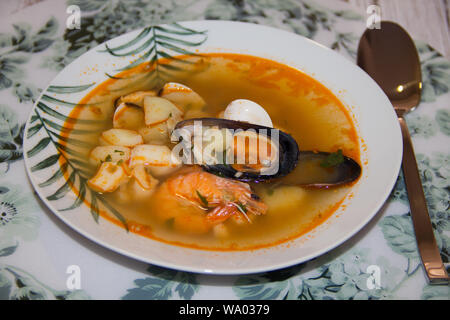 Incredibly delicious seafood soup. It is made from shrimp mussels and fish Stock Photo