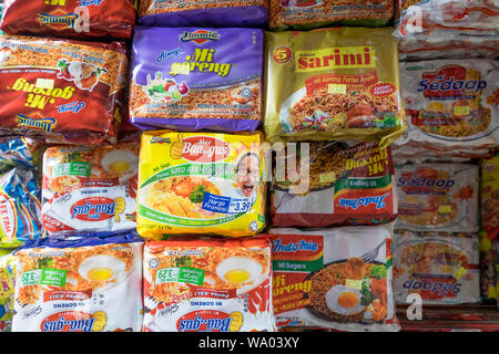 A wide selection of local soups and noodle dish packets are for sale in a market in Kuching, Malaysia. Stock Photo