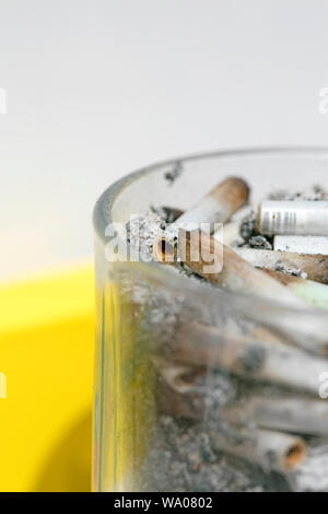 Ashes and joins from medical cannabis in glass macro background fifty megapixels prints Stock Photo