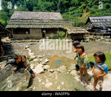 Happy kids poses in the yard, a village outside Sapa, Vietnam. Stock Photo