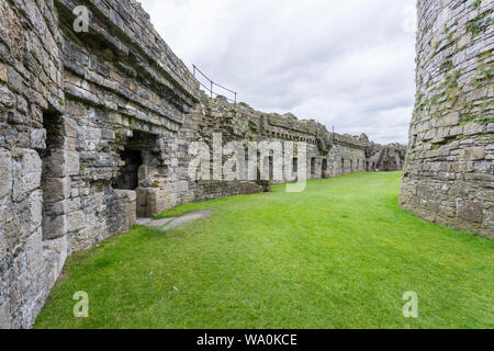 The impressive remains of the Outer Ward at the historic Beaumaris ...
