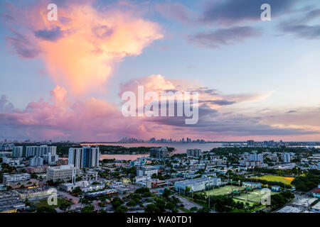 Miami Beach Florida,North Beach,Biscayne Bay,clouds weather sky storm clouds,rain,city skyline,sunset,FL190731016