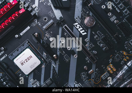 Valencia, Spain - August 12, 2019: AMD Ryzen 3700x processor in the X570 motherboard socket. New Zen 2, 7 nanometer desktop CPU by AMD. Very popular 3 Stock Photo