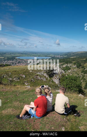 A Family take in the views from the top of Cheddar Gorge in Somerset, UK Stock Photo
