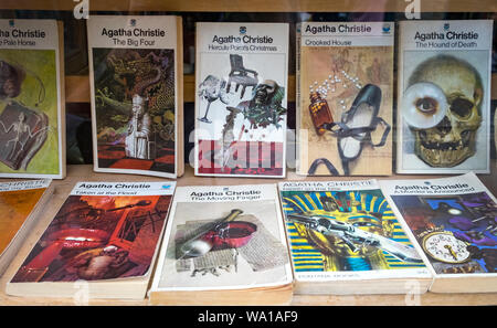 Selection of classic Agatha Christie books on display in a shop window at Hay-on-Wye in Wales Stock Photo