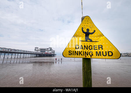 Danger Sinking Mud warning sign on the beach at Weston-Super-Mare in Somerset Stock Photo