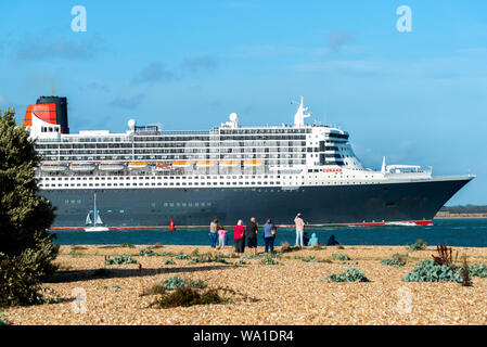 Queen Mary 2, the famous ocean liner, departing on a cruise from Southampton and sailing along The Solent on a summer afternoon.Hampshire,England,UK Stock Photo