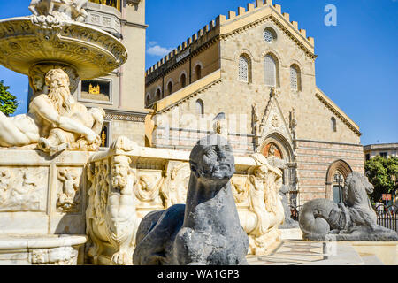 Messina Cathedral on the Mediterranean island of Sicily, Italy. Reclining marble figures and a sphinx highlight the Fountain of Orion in the Piazza Du Stock Photo