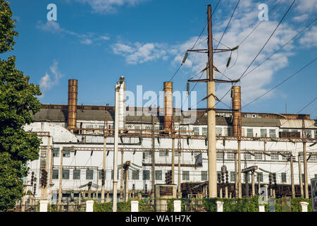 Industrial building with pipes. Shells of the plant.Industrial building with pipes. Shells of the plant. Stock Photo