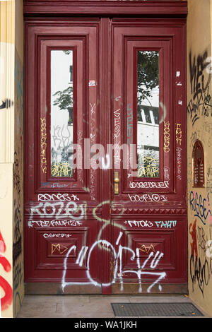 Antique door covered in graffiti, Berlin, Germany Stock Photo