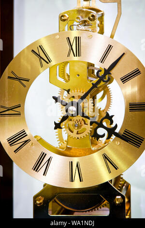 Close up shot of golden clock gears Stock Photo