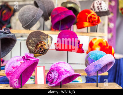 Woman felt hats on a market stall in Savonlinna in Finland Stock Photo