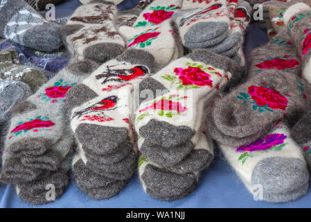 Hand knitted wool socks on a market stall in Savonlinna in Finland Stock Photo